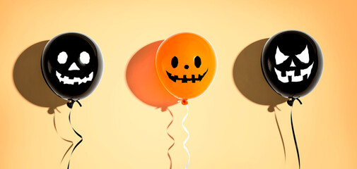 Fototapeta premium Halloween balloon ghosts with happy faces - flat lay