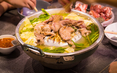 Grill barbecue on the pan and hot pot on the stove street buffet.  Barbecue Thai style.