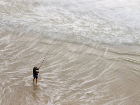View from above of a Fisherman beach fishing