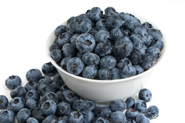 Blueberries in bowl isolated on white background