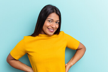 Fototapeta premium Young Venezuelan woman isolated on blue background happy, smiling and cheerful.