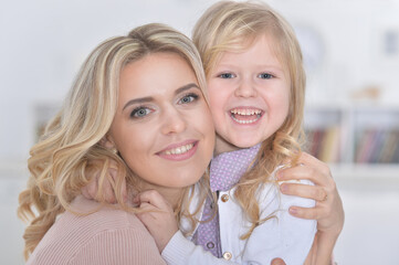 Close up portrait of little cute girl with mother