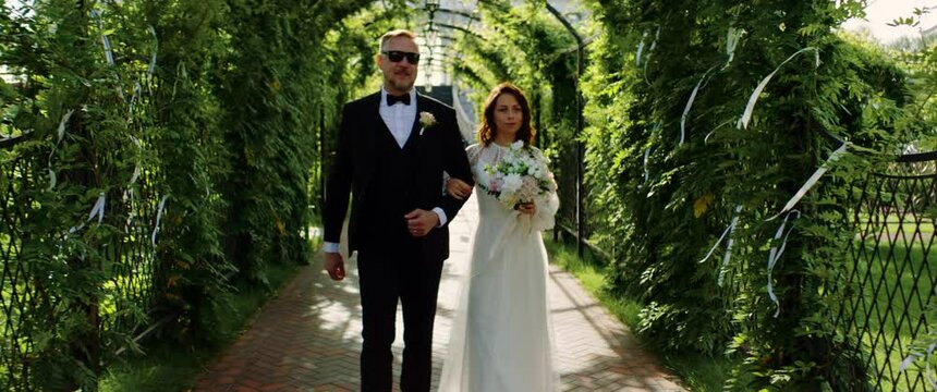 TRACKING Father of the bride walking down the aisle with his daughter toward the altar. Shot with 2x anamorphic lens