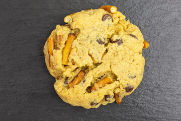 chocolate chip peanut butter cookie with pretzel sticks