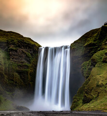 breath taking powerful Skogafoss waterfall  along route 1 in Iceland during summer.
