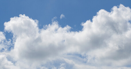 White clouds running over Bright blue sky.