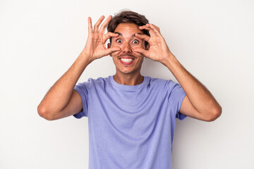 Young mixed race man isolated on white background keeping eyes opened to find a success opportunity.