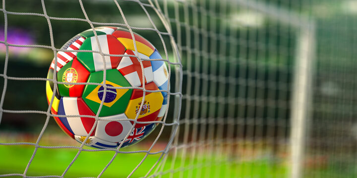 Football ball with flags of world countries in the net of goal of football stadium. World cup championship 2022.