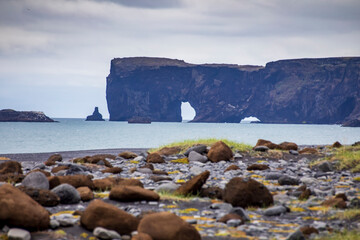 black sand beach in Dyrhólaey .It is a 120-metre high promontory, massive arch, rock formation  not far from Vík. 