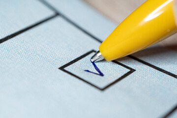 Voting yes or no check-box with fountain pen yes marked with V