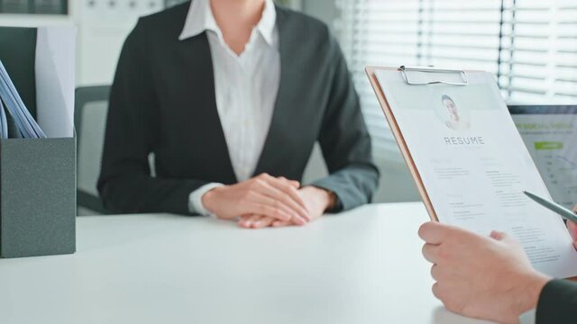 Close up of woman give resume to hr manager for job interview in office
