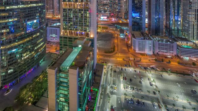 Dubai international financial center skyscrapers aerial night timelapse.