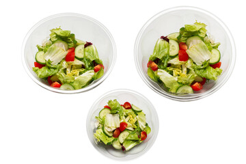 Salad with fresh vegetables isolated on a white background.