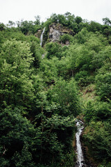 Two small waterfalls in a forest landscape in Georgia in the vicinity of Borjome