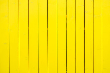 Yellow wood texture. Street fence made of wood