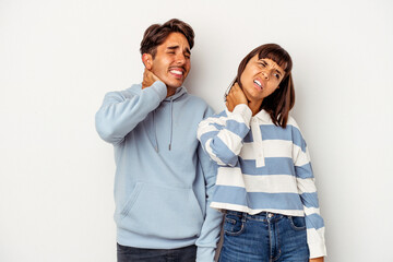 Young mixed race couple isolated on white background suffering neck pain due to sedentary lifestyle.