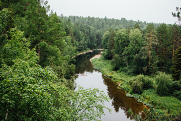 Beautiful natural landscape with a flowing river in the Olenyi Streams park in the Sverdlovsk region