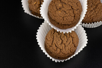 Delicious tasty snack of brown cookies with chocolate chip and peanut isolated on black background