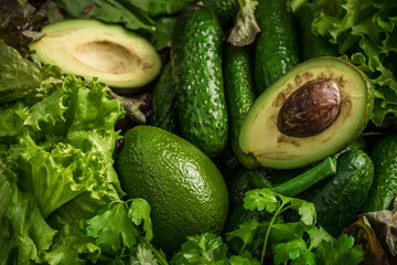Vegetarian still life. Green fruits. Natural background. Avocado and other greens.