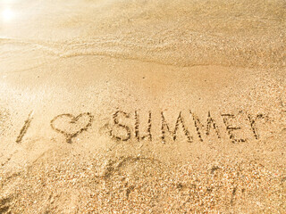 The inscription I love summer on the sea sand