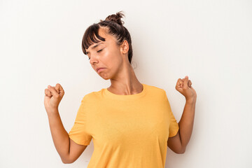 Young mixed race woman isolated on white background  stretching arms, relaxed position.