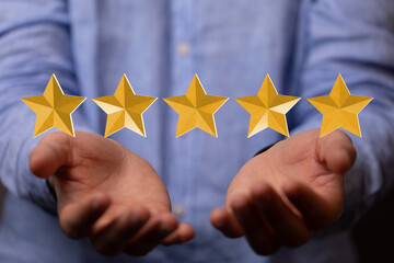 pointing five star symbol to increase rating of company