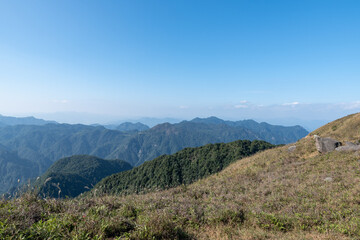 Look at the green mountains in the distance from the plateau meadow
