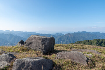 Stones on the plateau meadow under the blue sky