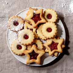 Linz shortbread biscuits cookies with jam on linen tablecloth. Flat lay