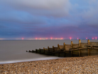 Goyne Water Ocean Breaker with Wind farm Lights in Background at Whitstable Beach