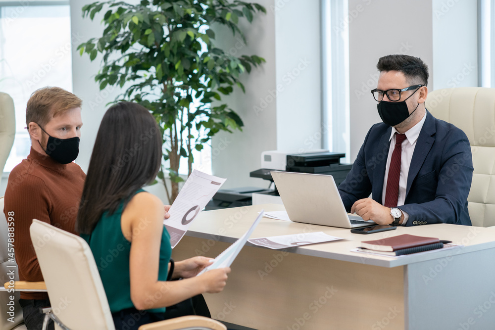 Poster Group of economists in protective masks discussing financial documents at meeting