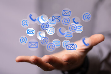 Hand holding using mobile phone with email icon on screen. Concept of business communication