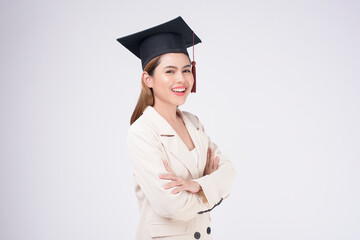 Portrait of young woman graduated over white background.