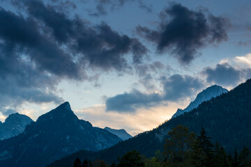 Obraz na płótnie Canvas Epic Mountain Clouds Mist in Austria at Sunset Sunrise