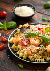 Prawn pasta salad with marinated green olives, cherry tomatoes and parmesan cheese.