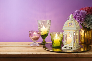 Diwali holiday concept with candles decoration on wooden table.