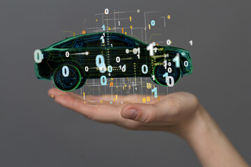 Man holding and touching holographic smart car