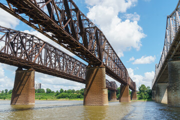 Three steel bridges over the Mississippi river, viewed from below