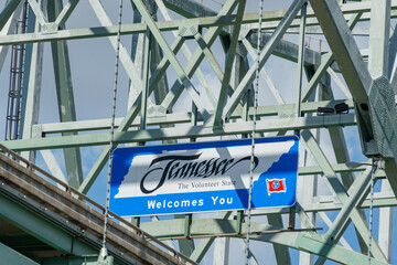 Tennessee welcome sign hanging from a steel bridge