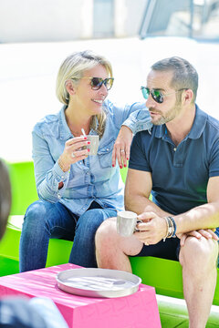 coffee break for an accomplice couple outside in their garden