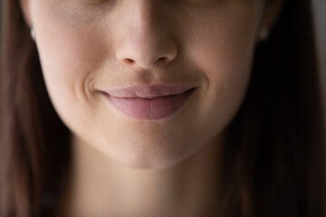 Crop close up of beautiful young woman mouth lips without makeup, lower face details, attractive...