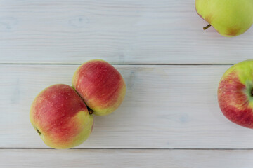 Ugly fruit concept. Two doubled apples connected together lie on white background,  copy space....