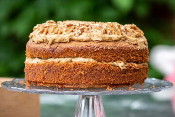 A Coffee and Walnut Cake on a Cake Stand for Afternoon Tea