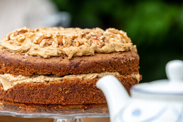 A Coffee and Walnut Cake on a Cake Stand for Afternoon Tea