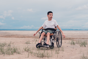 Fototapeta premium Happy handicapped teen smiling face, Sea beach background, Lifestyle happy disabled child travel , Good mental health concept