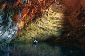 Melissani cave or Melissani lake near Sami town on Kefalonia island, Greece. Colorful artistic panorama photo. Tourism concept.