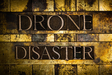 Drone Disaster text on textured grunge copper and vintage gold background 
