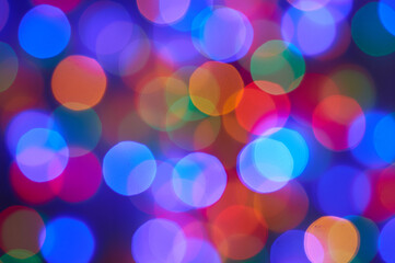  Blurred photo bokeh multicolored christmas lights .