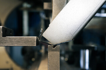 The bending was done from metal on a bending machine in close-up. 