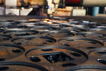 Parts cut from a sheet of metal on a laser machine. 
